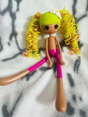 2014 Lalaloopsy Girls Pix E. Flutters with neon-colored hair that can be styled